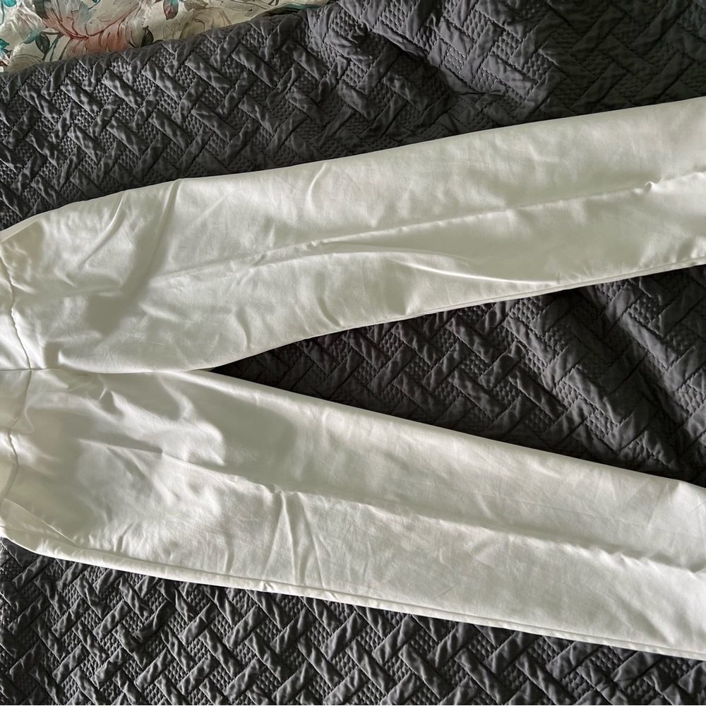 White slim fit pants with cuffs.